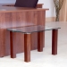 600x300mm safety glass table top with legs finished to walnut.