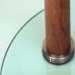 Detail showing the leg finished to cherry, and the UV bonded boss to the toughened glass.